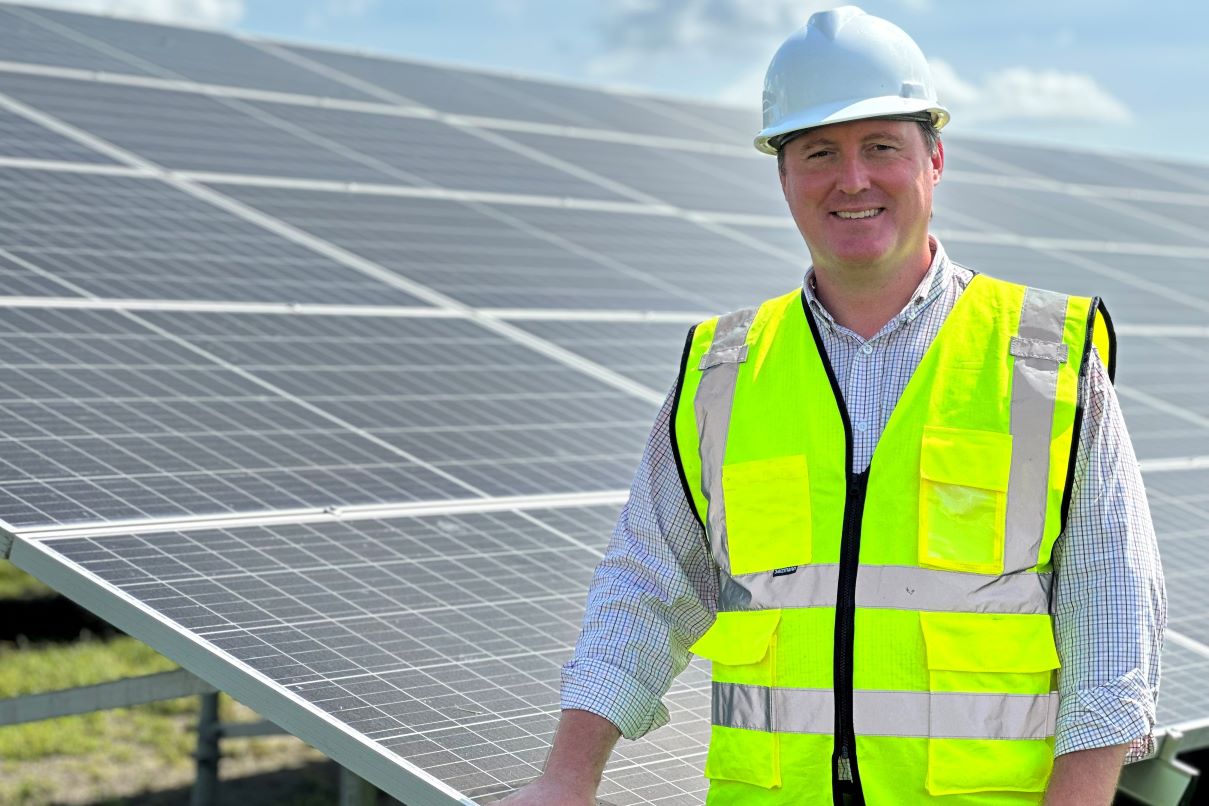 Andy Sauber, Sr. Director of Sustainability, at rice mill's solar array.